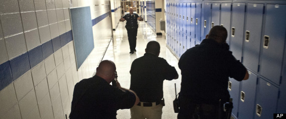 In this Thursday, Aug. 9, 2012 photo, Danville police work on 